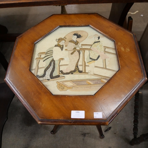 186 - A mahogany octagonal side table with Chinese silk panel