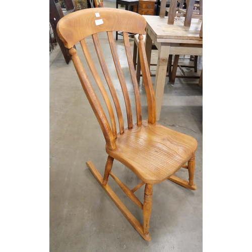 195 - A Victorian elm and beech rocking chair