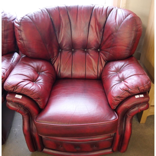 200 - An oxblood red leather armchair