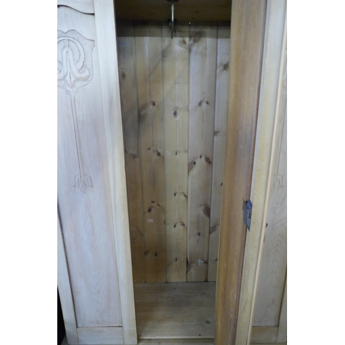 201 - An Art Nouveau carved beech single door wardrobe