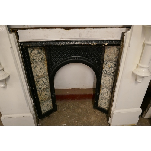 210 - A Victorian slate fire surround with cast iron tiled insert