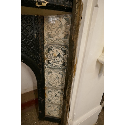 210 - A Victorian slate fire surround with cast iron tiled insert