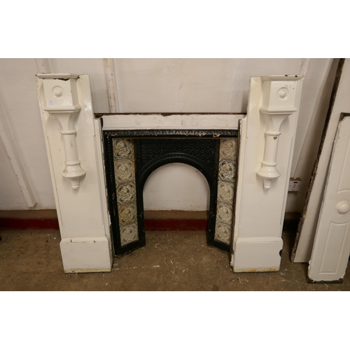 210 - A Victorian slate fire surround with cast iron tiled insert