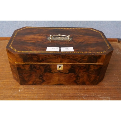 256 - A walnut jewellery box with inlaid top, handle and mother of pearl escutcheon