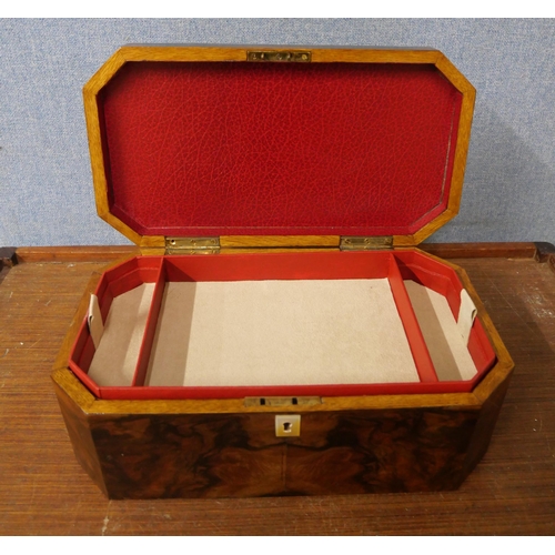 256 - A walnut jewellery box with inlaid top, handle and mother of pearl escutcheon