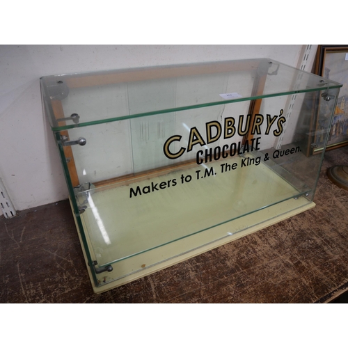 262 - A display cabinet bearing Cadbury's inscription