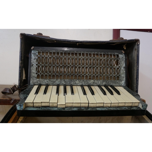 272 - A cased Barcarole accordion, cased