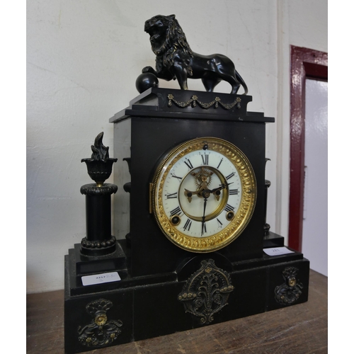 281 - A Belgian slate mantel clock with American movement with bronze lion, mounts and columns