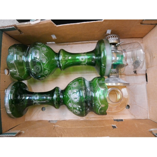 300 - Two green glass oil lamps