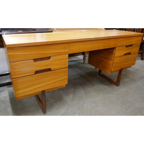 42 - A Uniflex teak desk