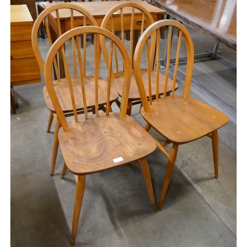 45 - A set of four Ercol Blonde elm and beech Windsor chairs