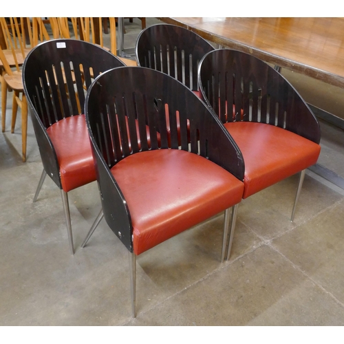 48 - A set of four Phillipe Starck style bent plywood, chrome and red vinyl chairs