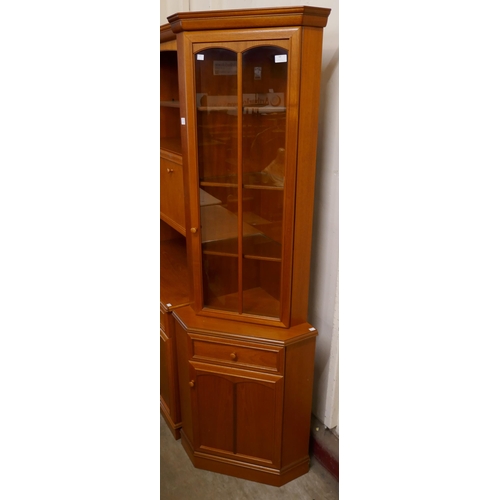 64 - A Stag teak corner cabinet