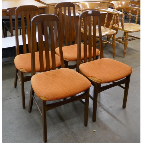 69 - A set of four teak dining chairs