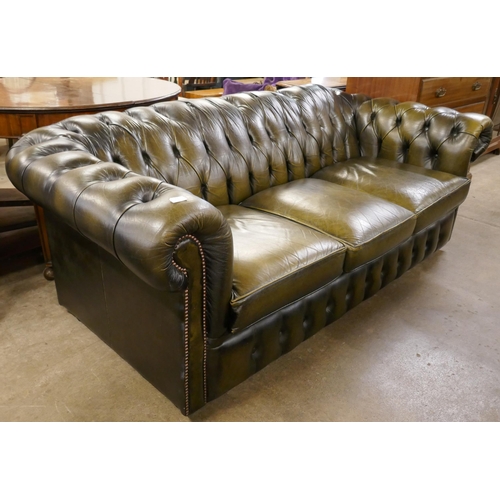 77 - A green leather Chesterfield settee
