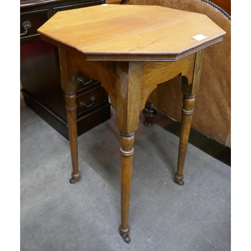 88 - An Arts and Crafts oak occasional table