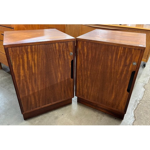 27 - A pair of teak cabinets