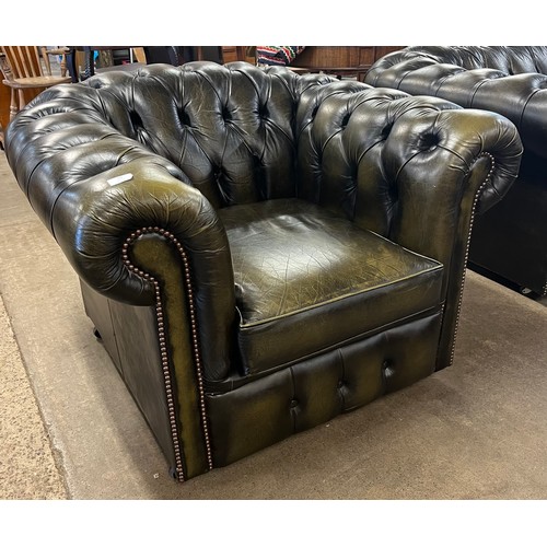 76 - A green leather Chesterfield club chair