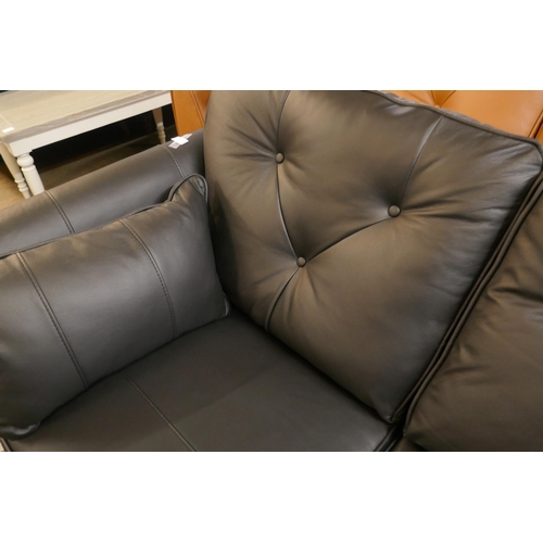 1307 - A black leather Hoxton two seater sofa and footstool RRP £2499