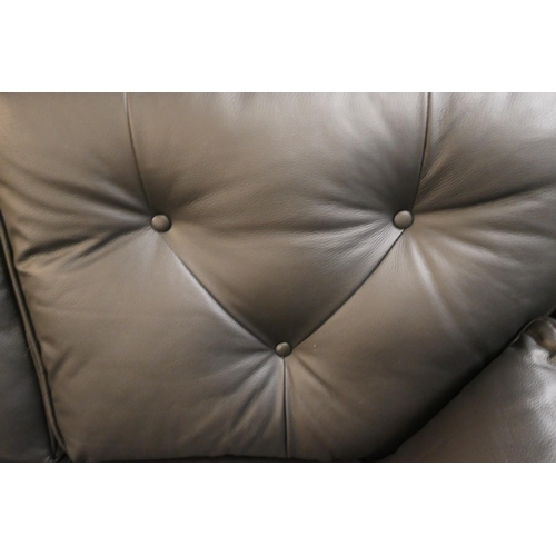 1307 - A black leather Hoxton two seater sofa and footstool RRP £2499