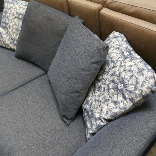 1399 - A blue upholstered three seater sofa, swivel armchair and footstool