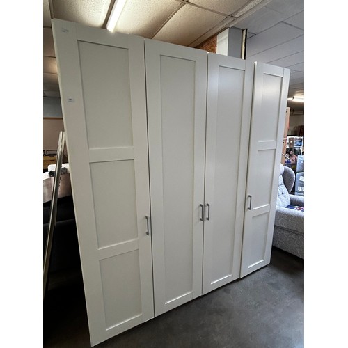 1494 - A white four door wardrobe * this lot is subject to VAT