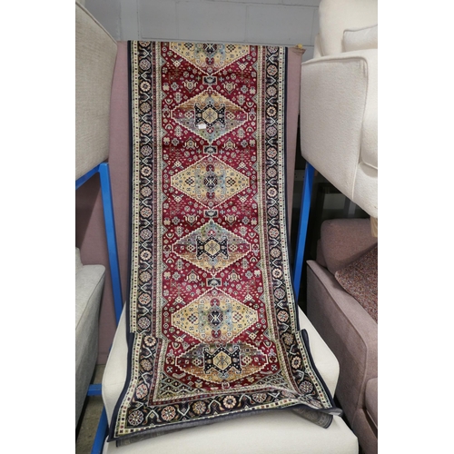 1501 - A deep multi coloured ground Keshan runner, diamond medallion design