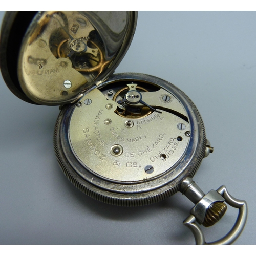 1003 - A Sandoz & Co. pocket watch, the case back depicts three figures tending the field, dial cracked