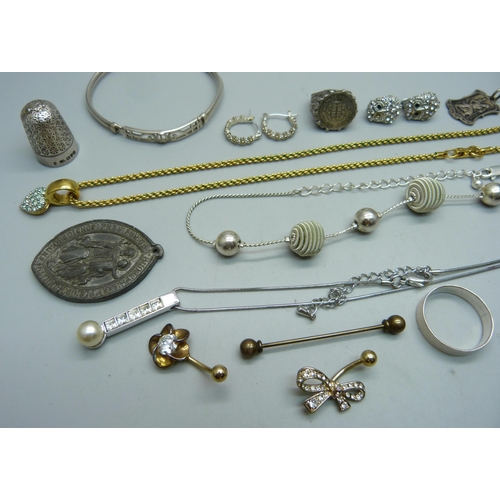 1008 - A Swarovski gold tone necklace, a Charles Horner thimble, two silver rings, two medallions, etc.