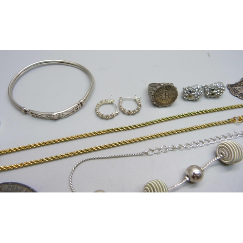 1008 - A Swarovski gold tone necklace, a Charles Horner thimble, two silver rings, two medallions, etc.