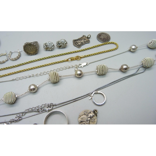 1008 - A Swarovski gold tone necklace, a Charles Horner thimble, two silver rings, two medallions, etc.