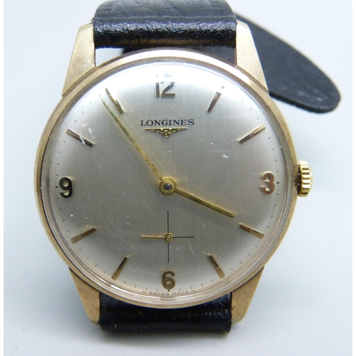 1014 - A 9ct gold cased Longines wristwatch, the case back bears inscription, 32mm case