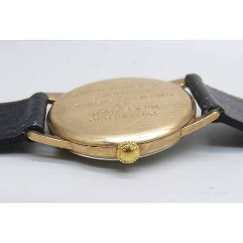 1014 - A 9ct gold cased Longines wristwatch, the case back bears inscription, 32mm case