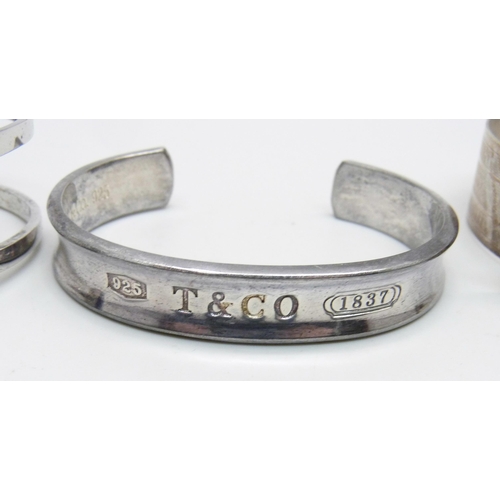 1022 - A Tiffany 925 silver bangle and two other silver bangles, 92g