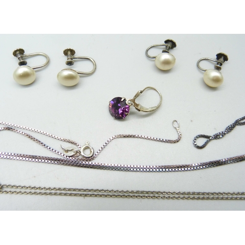 1032 - A collection of silver chains, two pairs of earrings and a single earring