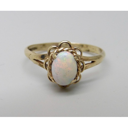 1036 - A 9ct gold and opal solitaire ring, 1.3g, L