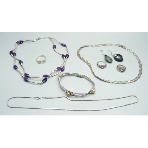 1039 - A collection of silver jewellery and a pair of unmarked earrings