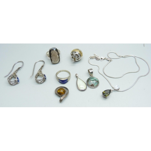 1040 - Jewellery; four silver pendants, two silver rings, a pair of earrings and a silver pendant and chain