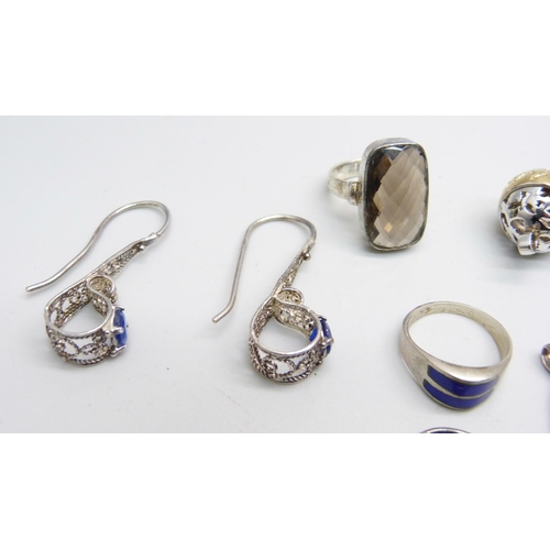 1040 - Jewellery; four silver pendants, two silver rings, a pair of earrings and a silver pendant and chain