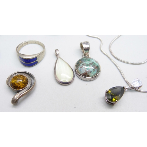 1040 - Jewellery; four silver pendants, two silver rings, a pair of earrings and a silver pendant and chain