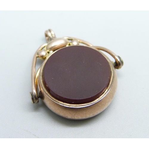 1042 - A 9ct gold swivel fob set with  and red agate, total weight 7.1g