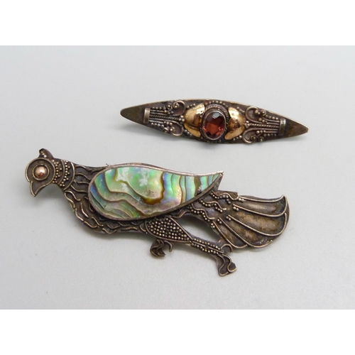 1063 - Two silver Arts and Crafts brooches, including one bird brooch with mother of pearl detail