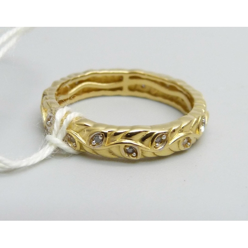 1070 - A 925 silver and gold plated diamond eternity ring, O