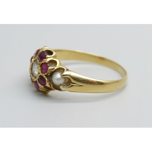 1075 - A vintage yellow metal, diamond, ruby and pearl ring, 2.1g, K/L, (tests as 18ct gold)