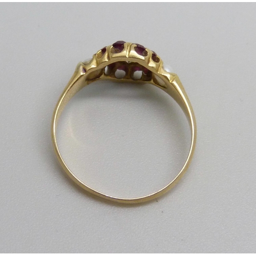 1075 - A vintage yellow metal, diamond, ruby and pearl ring, 2.1g, K/L, (tests as 18ct gold)