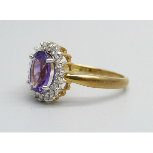 1080 - An 18ct gold, amethyst and diamond cluster ring, 4.5g, Q