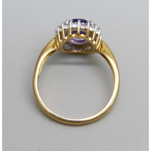 1080 - An 18ct gold, amethyst and diamond cluster ring, 4.5g, Q