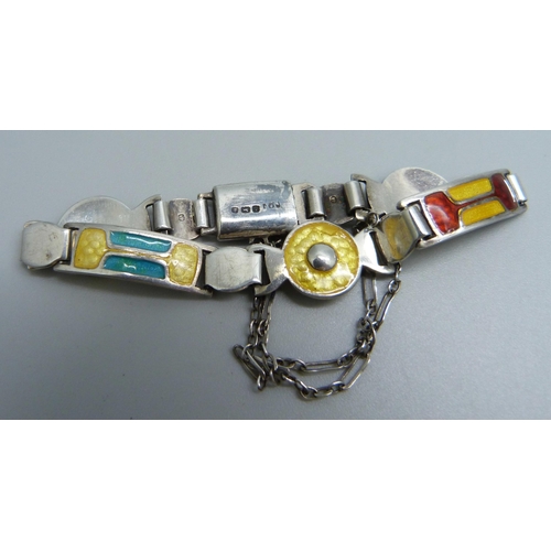 1081 - A silver and enamelled bracelet by James Fenton, one enamel panel a/f