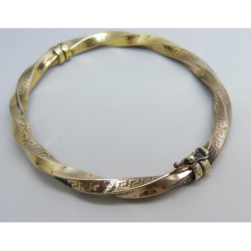 1084 - A hallmarked 9ct gold bangle, 11.8g