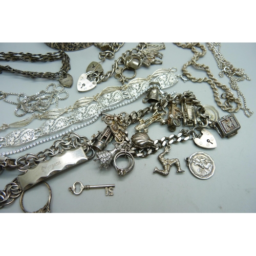 1089 - A collection of silver jewellery including two charm bracelets, 248g